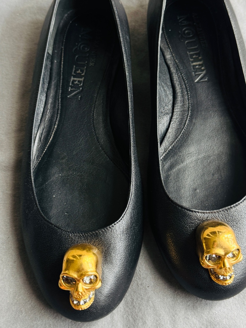 Alexander McQueen Black Leather Flats with Gold Skull Accent